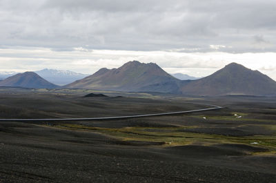 Scenic view of landscape and mountains against sky