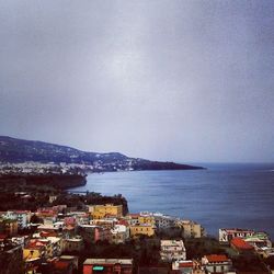 View of cityscape with sea in background