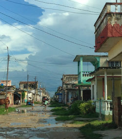 Street amidst buildings against sky