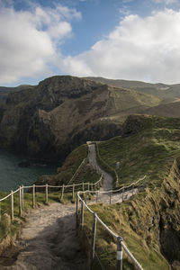 Scenic view of landscape against cloudy sky