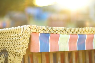 Close-up of hooded beach chair during sunny day