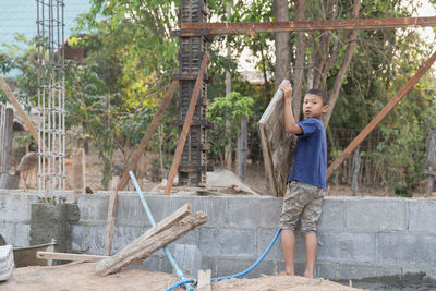 Concept of poverty and child labor, children who are working on construction sites .