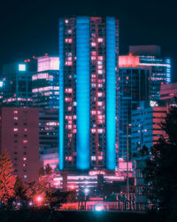 Illuminated buildings in city at night