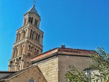 Low angle view of building against blue sky