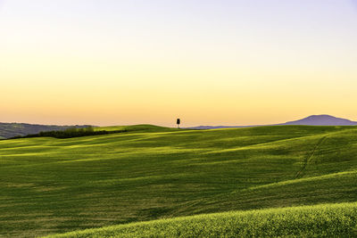 Scenic view of landscape against sky during sunset