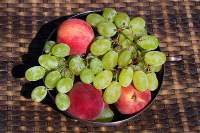 High angle view of fruits in basket on table