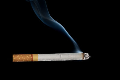 Close-up of smoke against black background