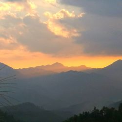 Low angle view of mountains against sky during sunset