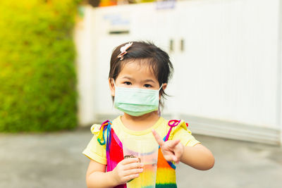 Portrait of boy drinking coffee