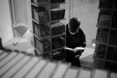 Man sitting on table at home