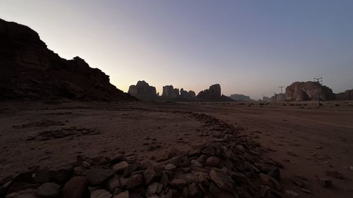 Rock formations on landscape against clear sky