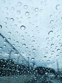 Full frame shot of raindrops on glass window