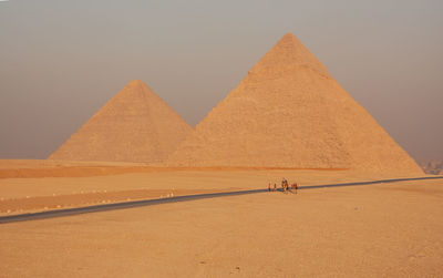 Egypt. cairo - giza. general view of pyramids with camels