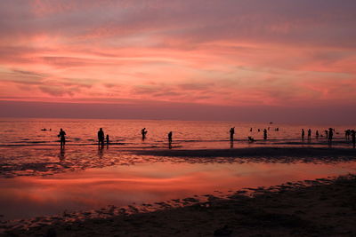 Scenic view of sea against orange sky