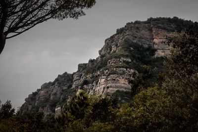 Low angle view of rock formations against sky