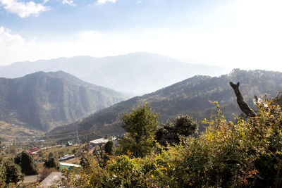 High angle view of trees and mountains against sky