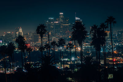 Illuminated buildings in city at night