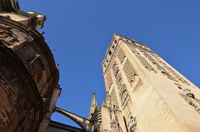 Low angle view of building against clear blue sky