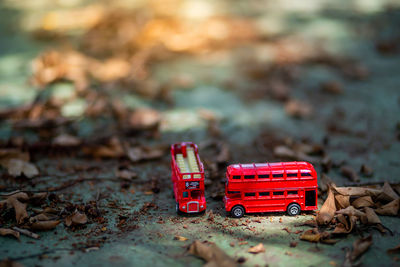 Close-up of abandoned toy car on field