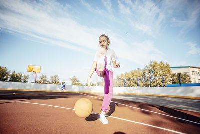 Golden hour glory, a girl's basketball passion shines bright on the basketball court