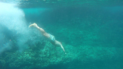 Woman swimming in sea