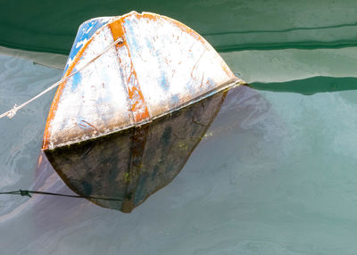 High angle view of boat floating on lake