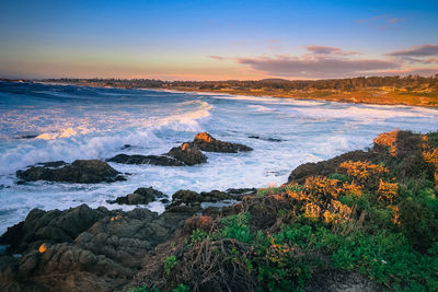 Scenic view of sea against sky during sunset