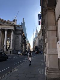 People walking in front of buildings