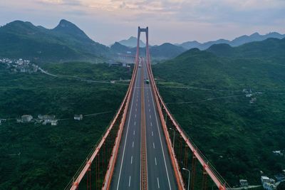 High angle view of road by mountain against sky