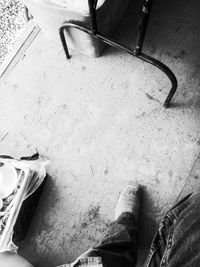 Low section of person standing on tiled floor