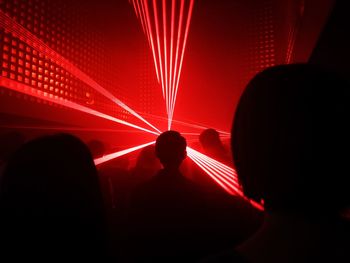 Rear view of silhouette people at music concert