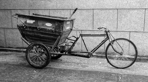 Bicycles parked against wall