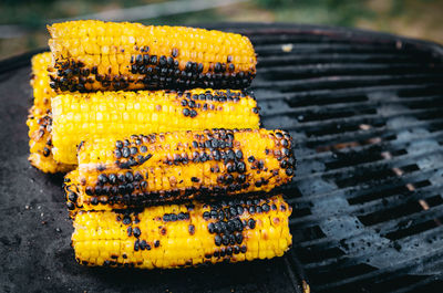 Close-up of yellow meat on barbecue grill