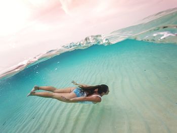 Woman swimming in sea