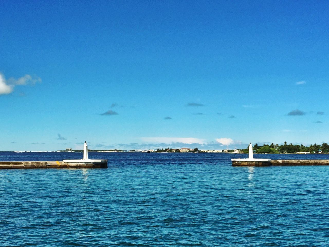 blue, water, waterfront, sea, tranquil scene, tranquility, sky, scenics, rippled, copy space, beauty in nature, nature, transportation, built structure, calm, idyllic, day, ocean, outdoors, pier