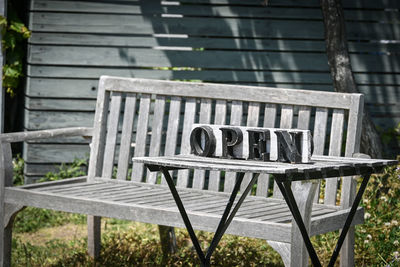 Empty chairs and table in park