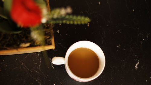 High angle view of coffee cup on table