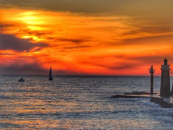 Scenic view of sea against orange sky