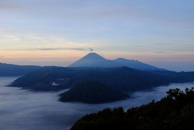 Scenic view of mountains against sky during sunset