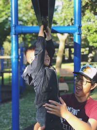 Son with father playing at park