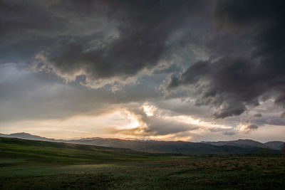 Scenic view of landscape against sky during sunset