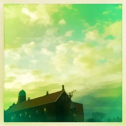 Low angle view of building against cloudy sky