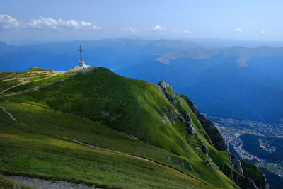 Scenic view of landscape and mountains against sky