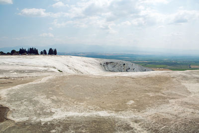 White calcium mountain with granite with small waterfall in summer in pamukkale turkey