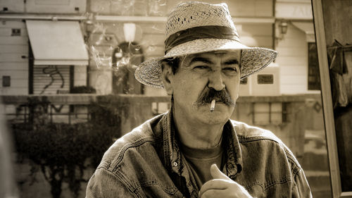 Portrait of man wearing hat