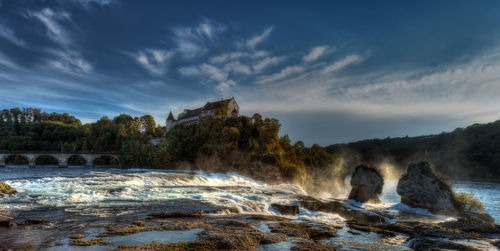 Long exposure photograph of the rhein falls with the laufen castle on the background.