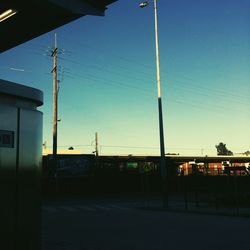 Lamp post against blue sky