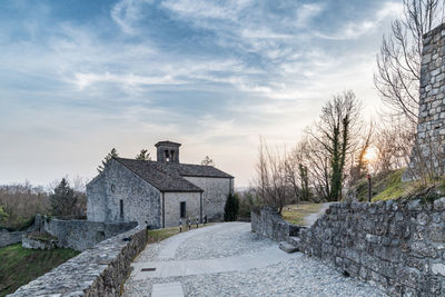 Sunset on the ancient castle of ragogna, italy. fortress guarding the ford on the river tagliamento