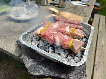 High angle view of meat on barbecue grill