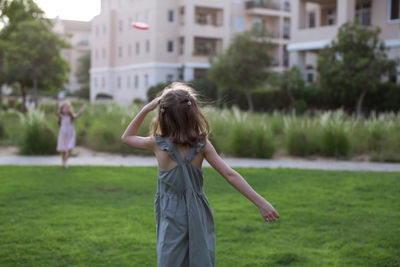 Full length of woman standing on grass